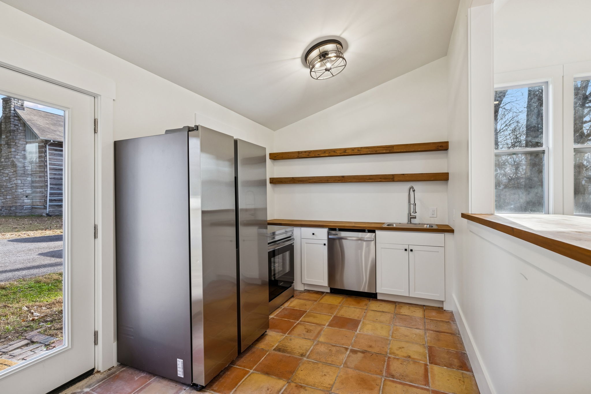 6633 Pinkston Road College Grove, TN 37046 - Photo 54 of 78 a kitchen with stainless steel appliances granite countertop a refrigerator and a sink