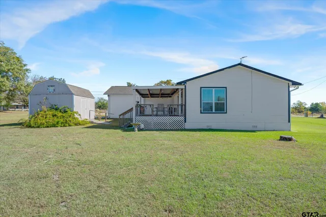 a house view with a garden space
