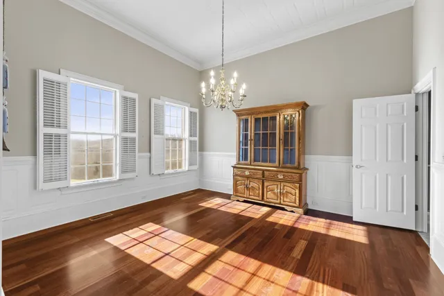 a bathroom with a sink a toilet and a large mirror