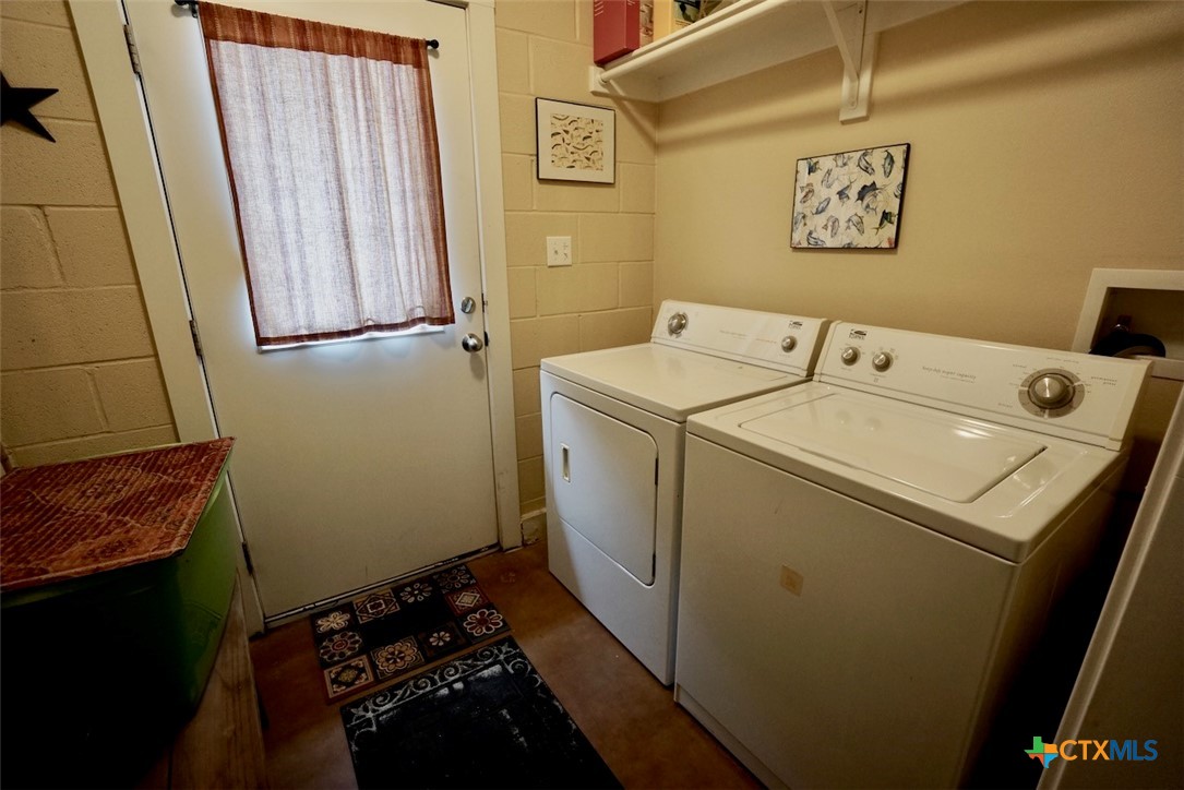 75-unit # 2 75-unit Street Port O'Connor, TX 77982 - Photo 14 of 18 a utility room with dryer and washer