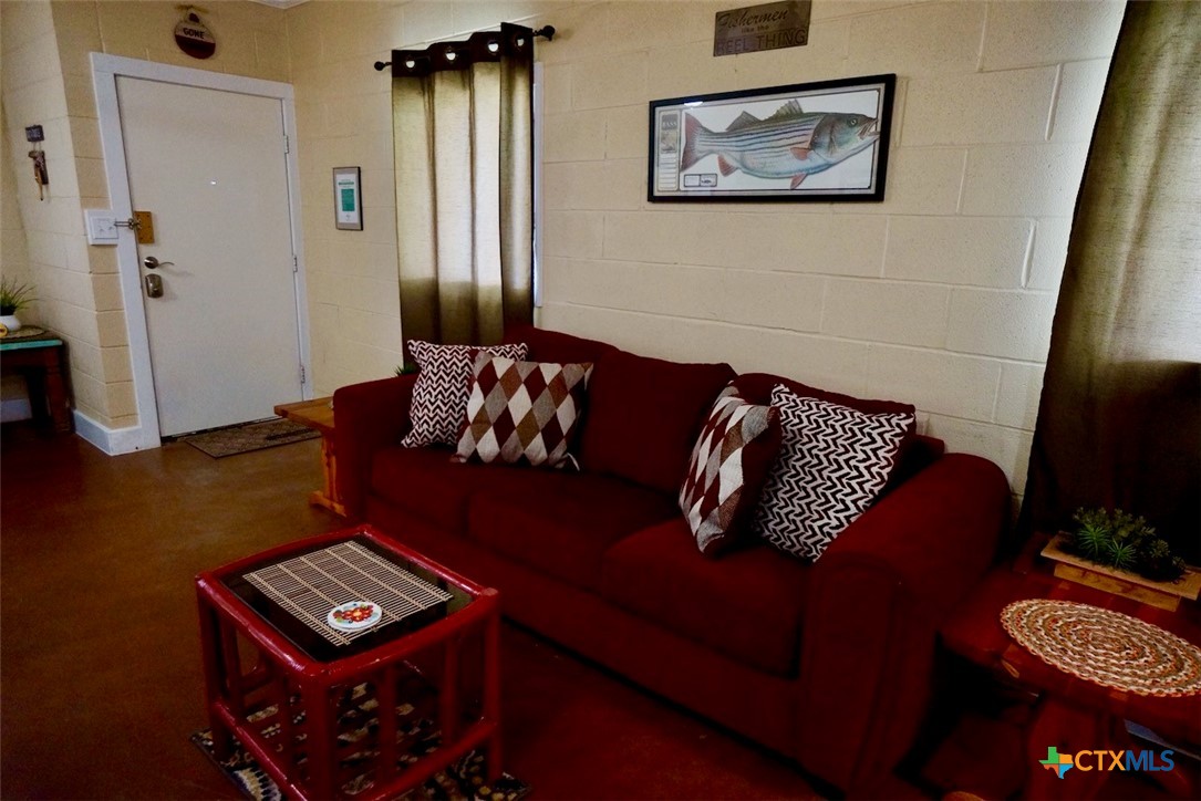 75-unit # 2 75-unit Street Port O'Connor, TX 77982 - Photo 6 of 18 a living room with furniture and a window