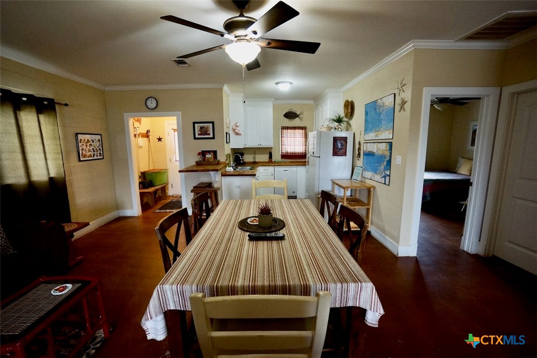 75-unit # 2 75-unit Street Port O'Connor, TX 77982 - Photo 8 of 18 a view of a dining room with furniture and wooden floor