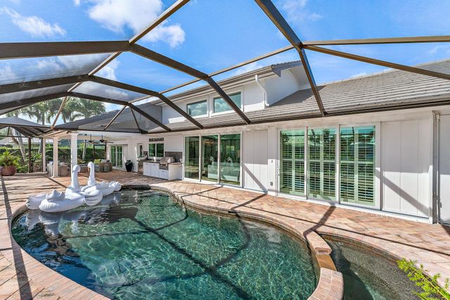a view of a dining area with furniture and a clock