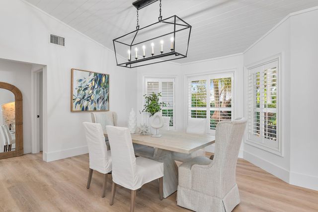 a spacious bedroom with a bed and a large window