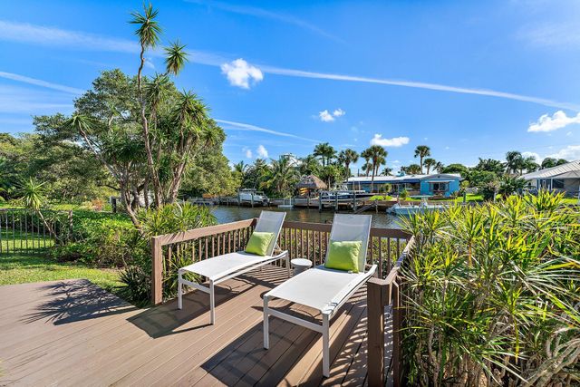 a view of a balcony with chairs