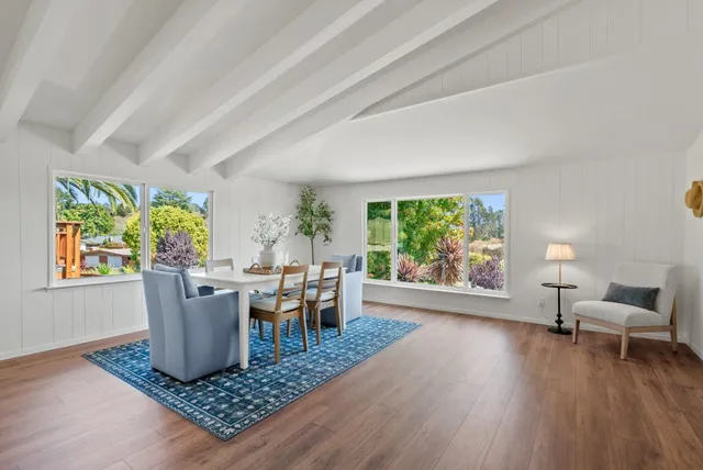 a living room with furniture and a table