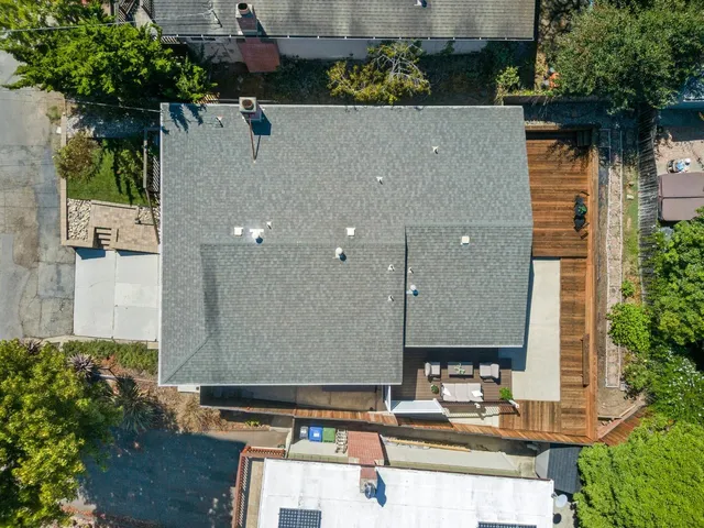 an aerial view of a house with a swimming pool