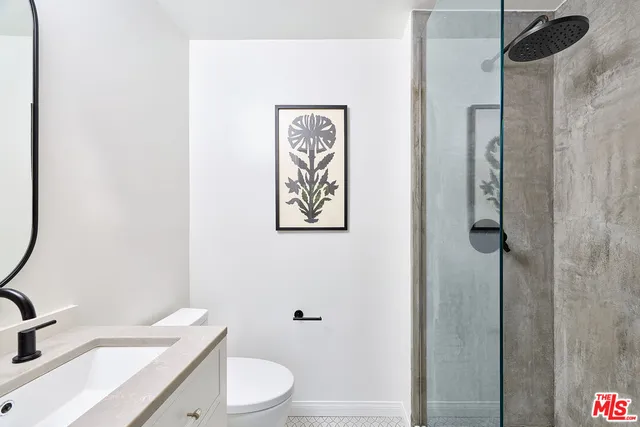 a view of a bedroom with wooden floor and hallway