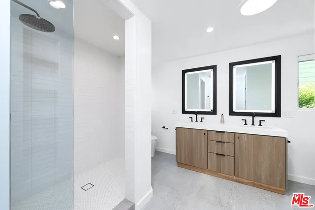 a bathroom with a bathtub and shower