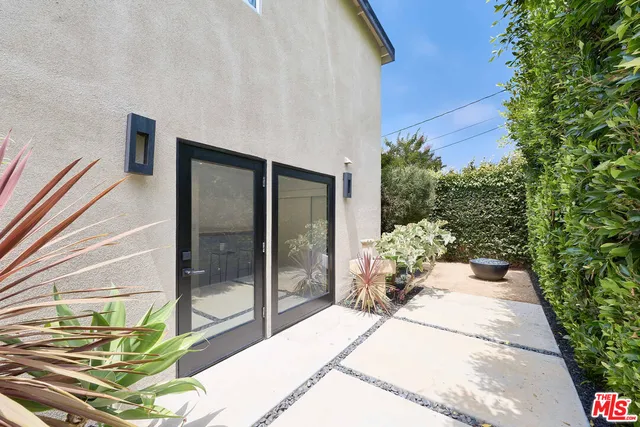 a view of house and wooden door