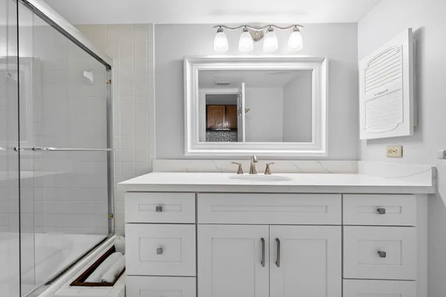 a bathroom with a sink and a mirror