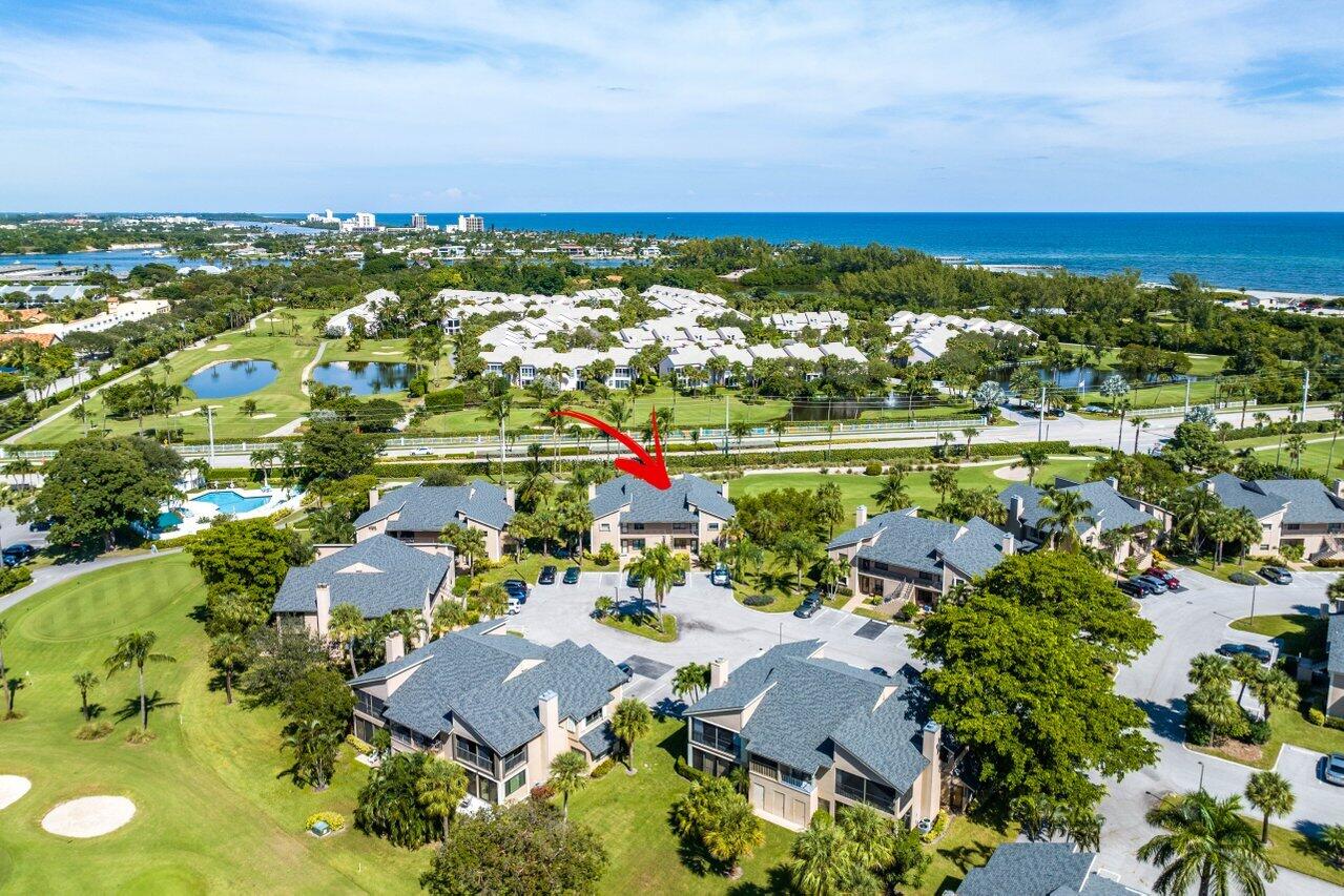 401 Clubhouse Circle, Unit 401A Jupiter, FL 33477 - Photo 28 of 34 an aerial view of residential houses with outdoor space and trees all around