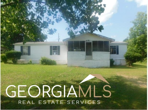 681 Holman Road Leslie, GA 31764 - Photo 1 of 1 a front view of a house with garden