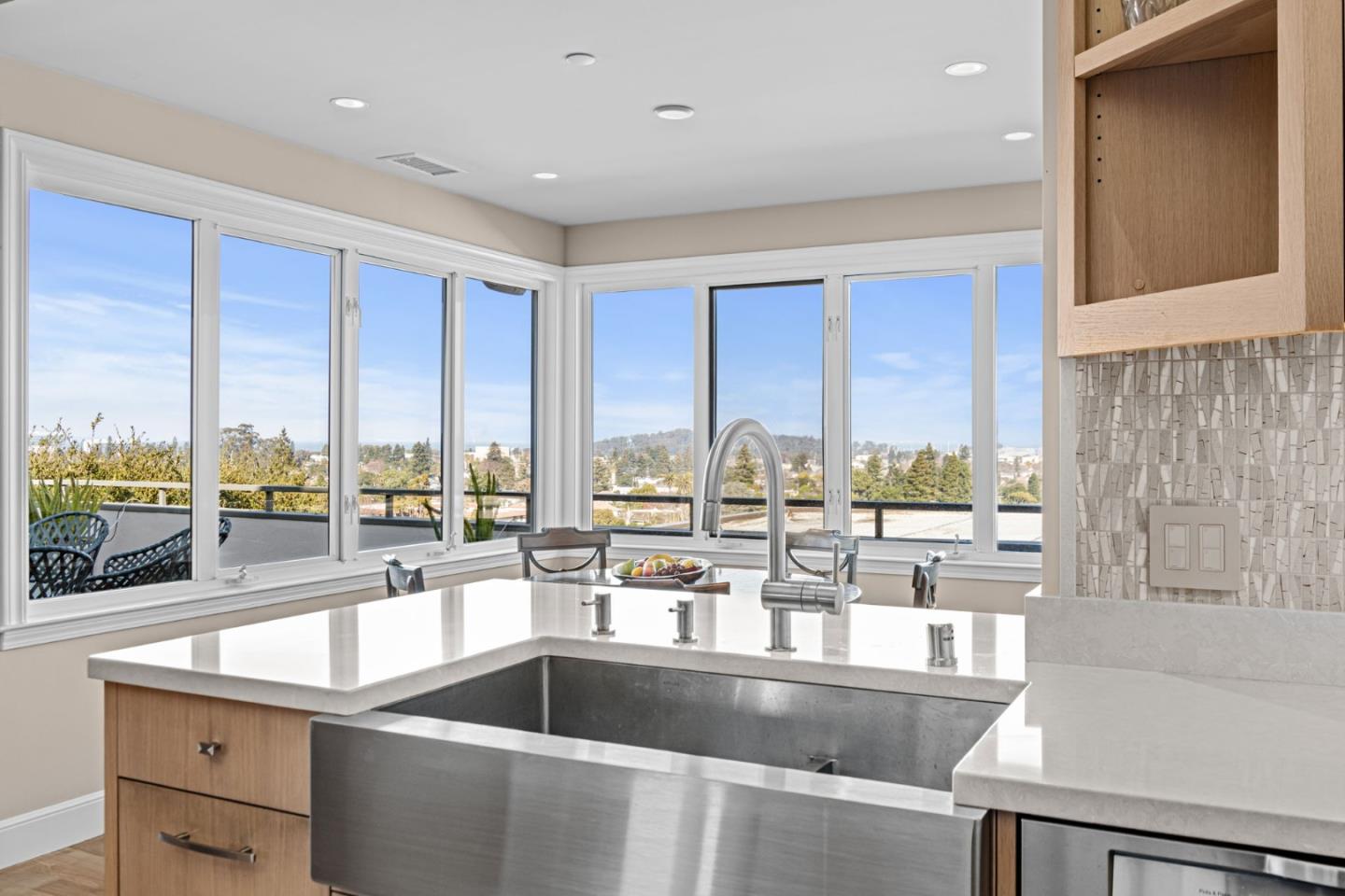 24 Mounds Road, Unit E San Mateo, CA 94402 - Photo 5 of 8 a kitchen with a large window and a view of living room
