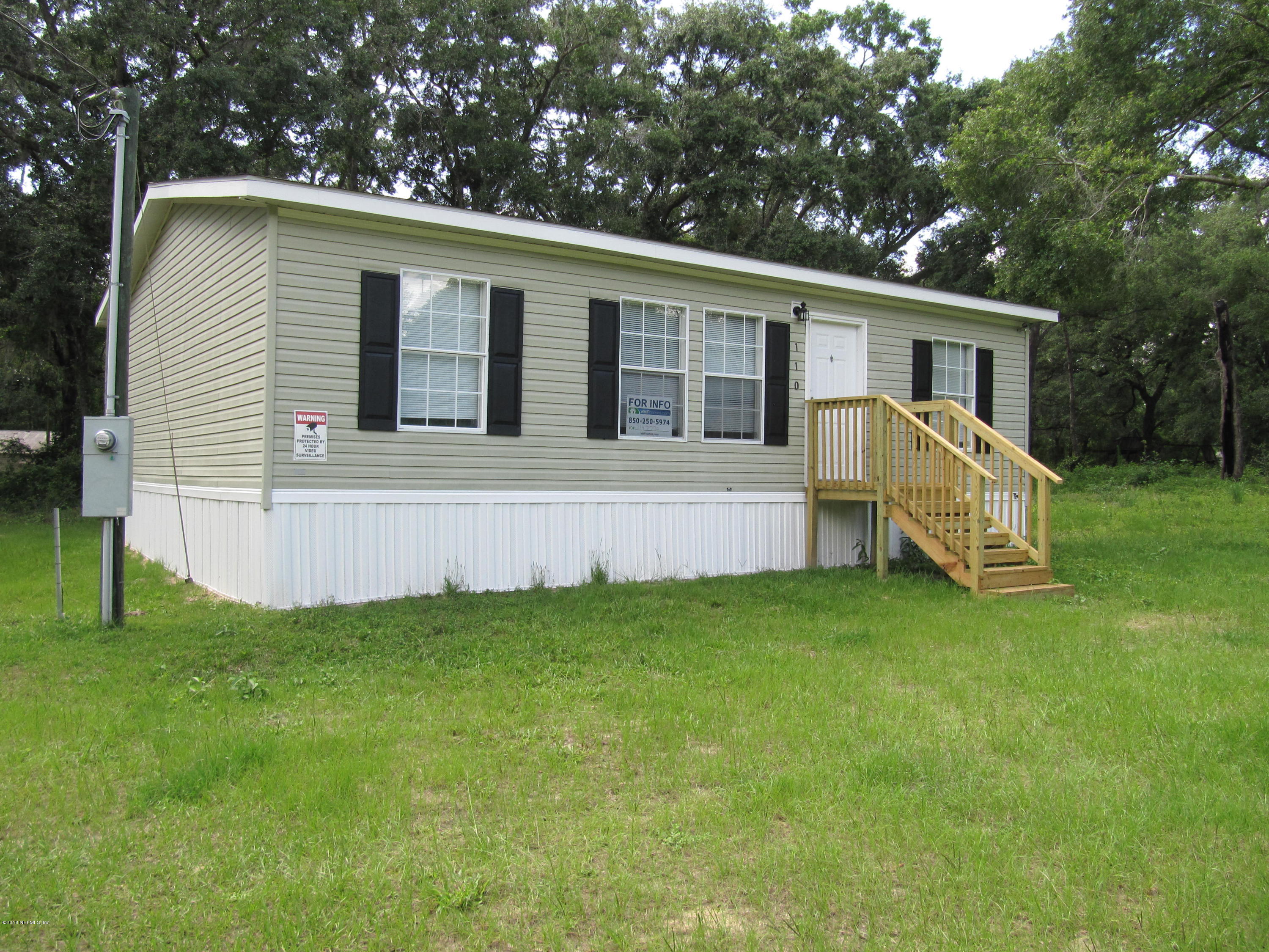 110 Putnam Loop Road Melrose, FL 32666 - Photo 1 of 7 a view of a house with a backyard