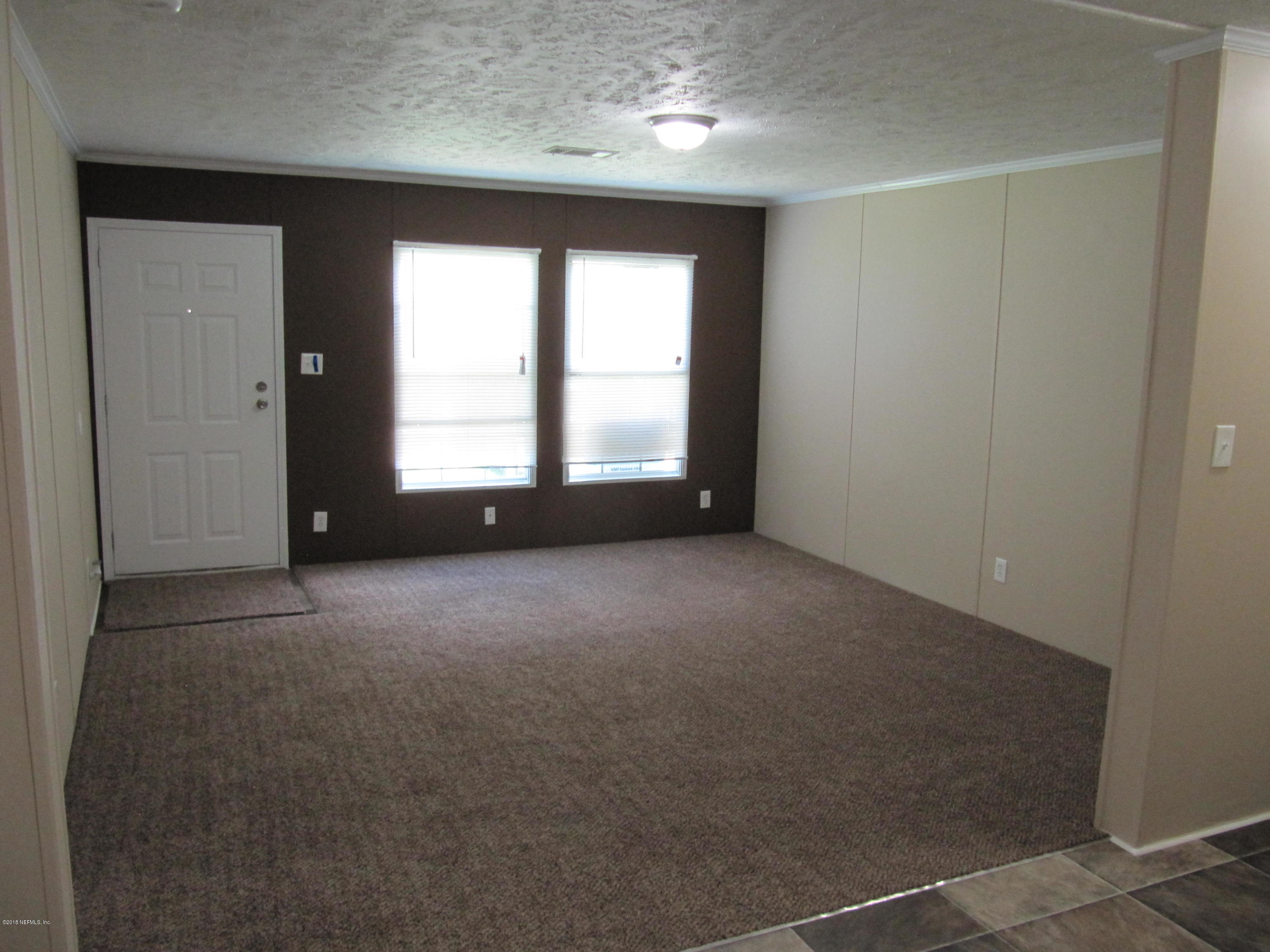 110 Putnam Loop Road Melrose, FL 32666 - Photo 4 of 7 wooden floor and window in an empty room