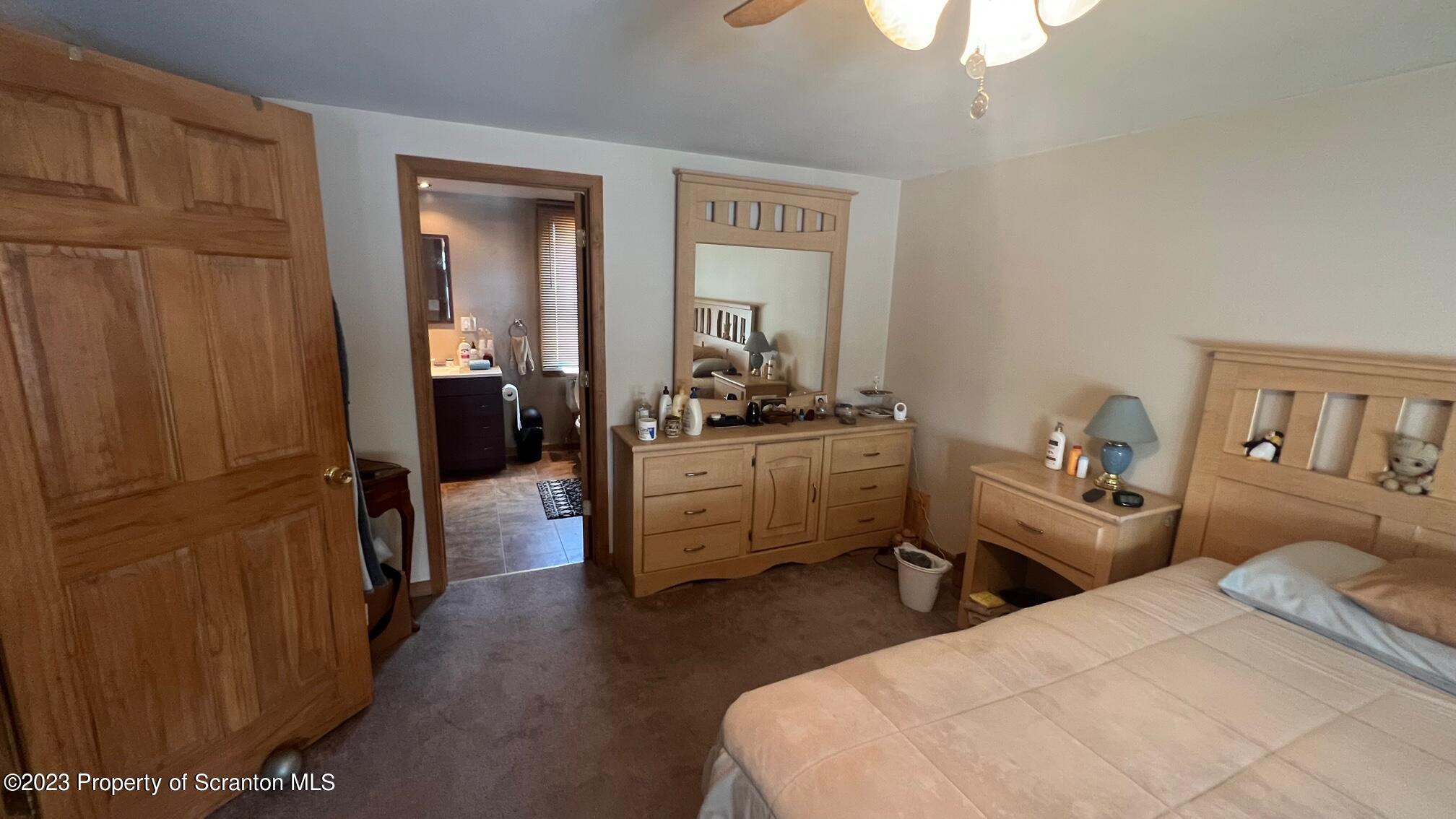 526 George Street Old Forge, PA 18518 - Photo 13 of 43 a bedroom with furniture and a window