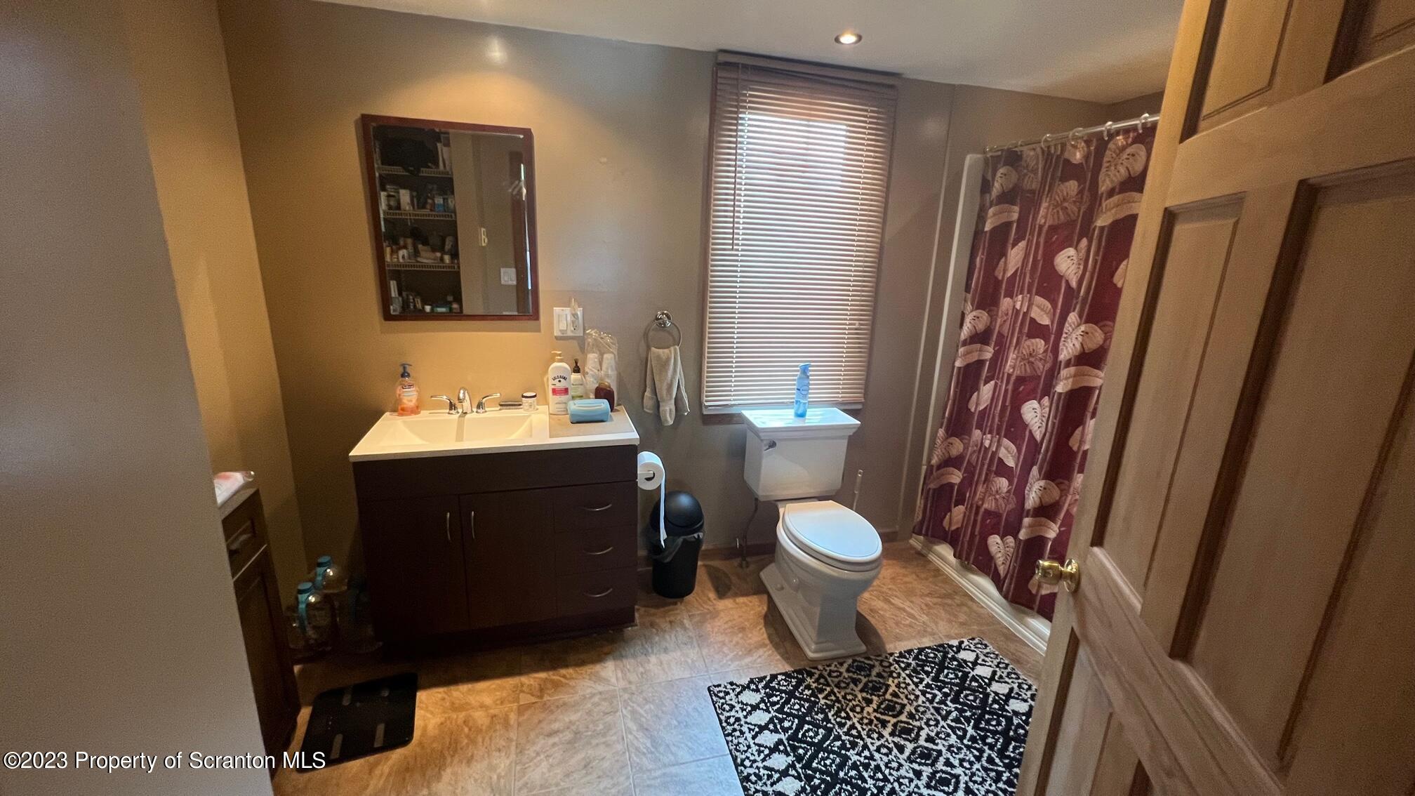 526 George Street Old Forge, PA 18518 - Photo 14 of 43 a bathroom with a sink toilet and shower