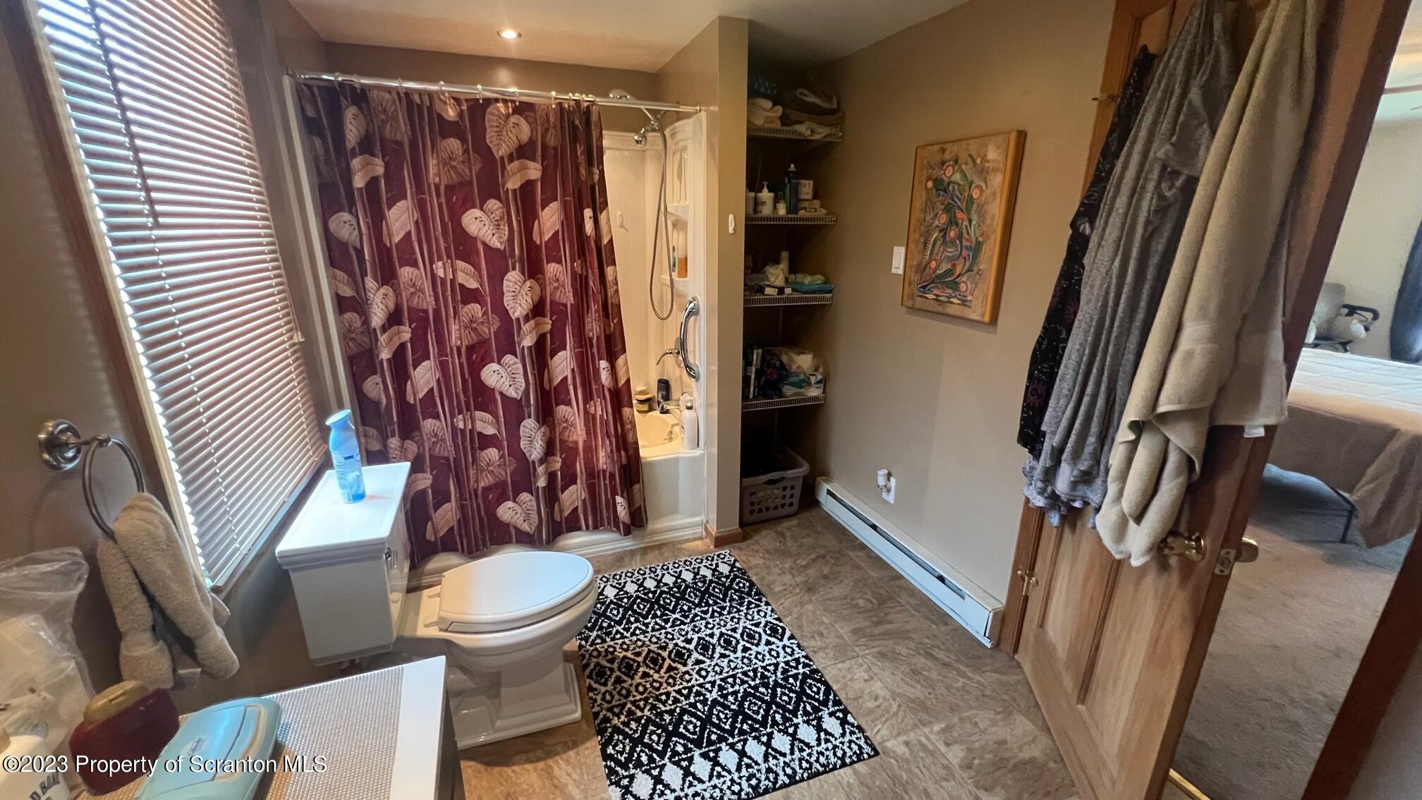 526 George Street Old Forge, PA 18518 - Photo 15 of 43 a bathroom with a toilet and a shower