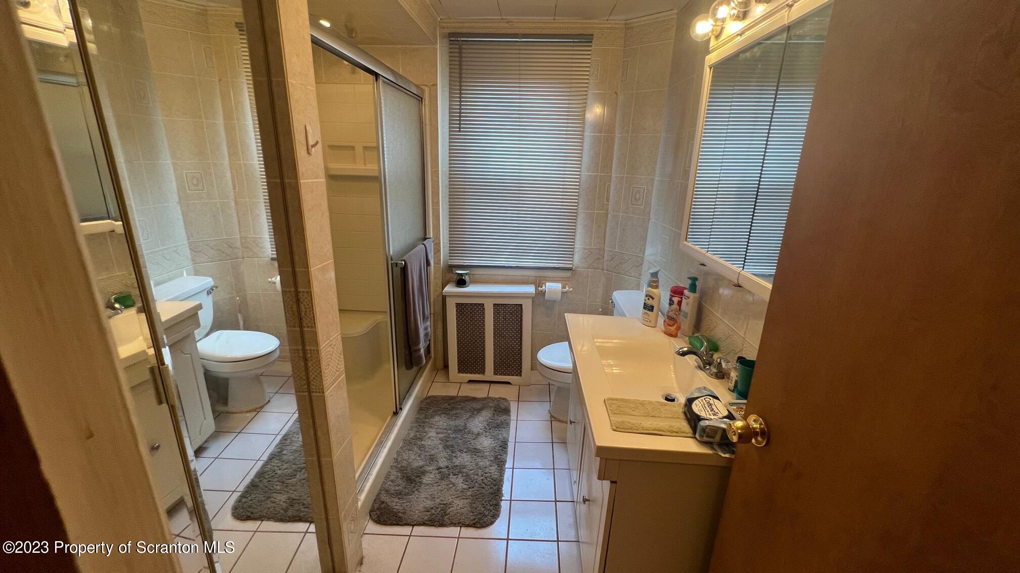 526 George Street Old Forge, PA 18518 - Photo 16 of 43 a bathroom with sink and mirror