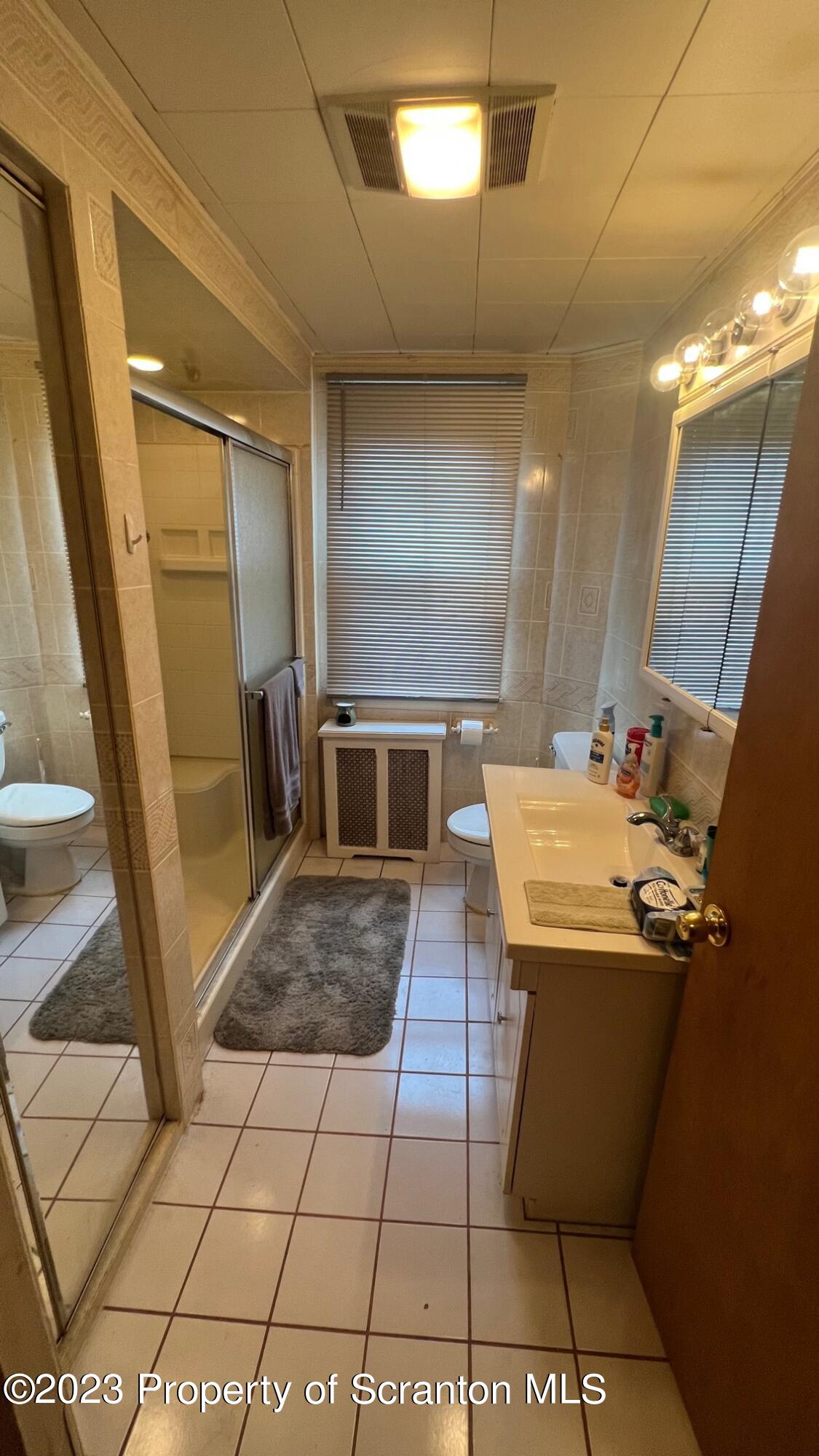 526 George Street Old Forge, PA 18518 - Photo 17 of 43 a bathroom with a sink and a mirror