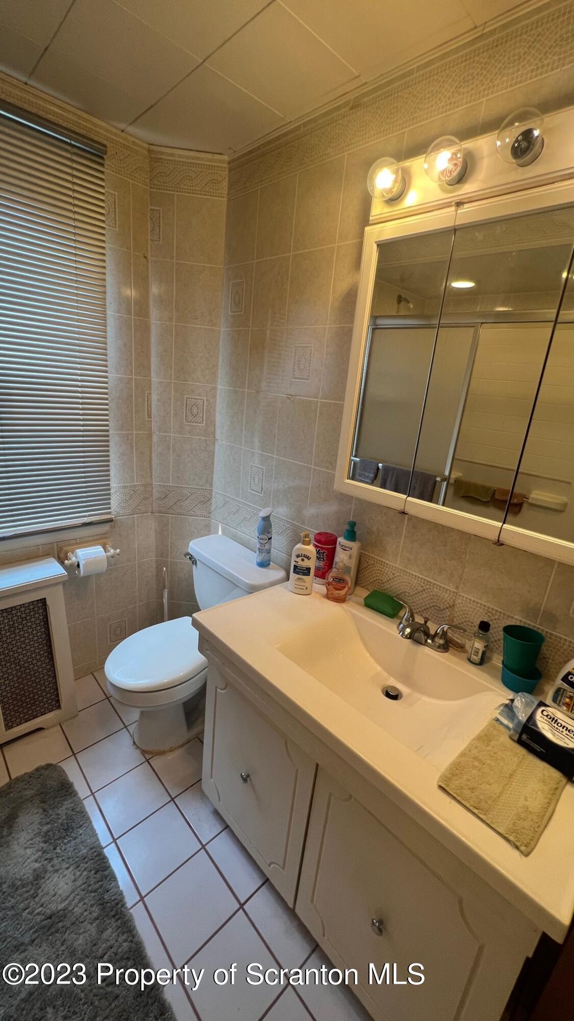 526 George Street Old Forge, PA 18518 - Photo 19 of 43 a bathroom with a sink and a mirror