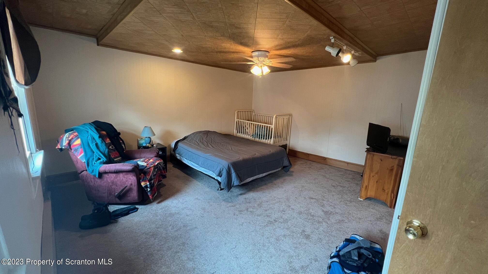 526 George Street Old Forge, PA 18518 - Photo 20 of 43 a living room with furniture and a flat screen tv