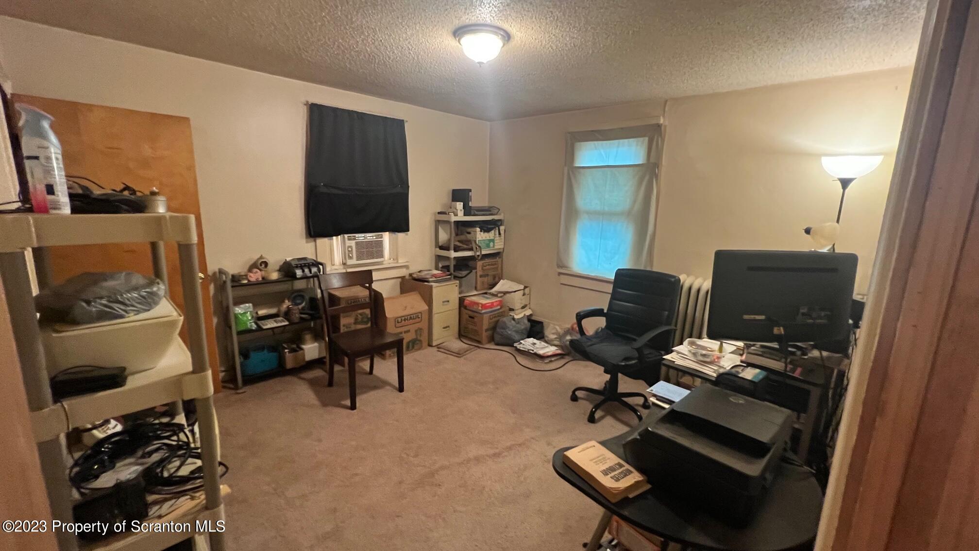 526 George Street Old Forge, PA 18518 - Photo 23 of 43 a view of a workspace with furniture and a window