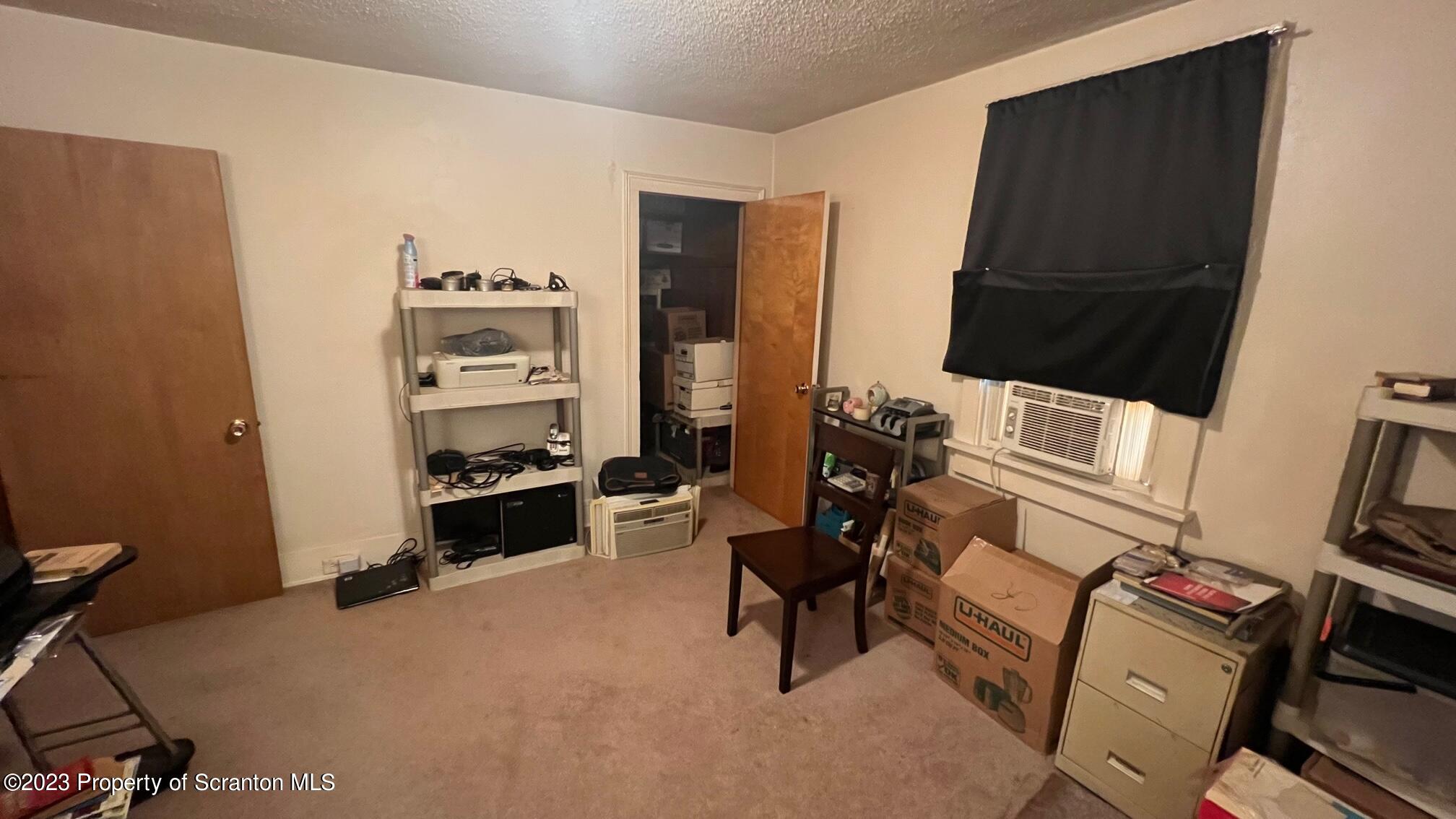 526 George Street Old Forge, PA 18518 - Photo 24 of 43 a bedroom with furniture and a flat screen tv