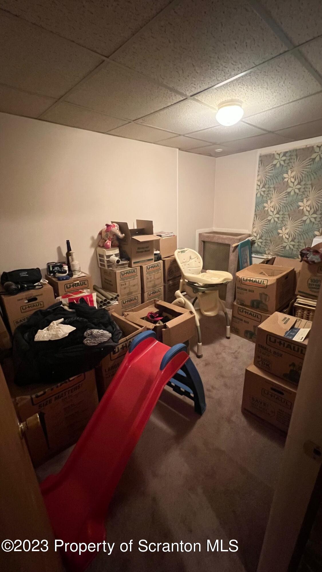 526 George Street Old Forge, PA 18518 - Photo 25 of 43 a living room with furniture a large window and a projector