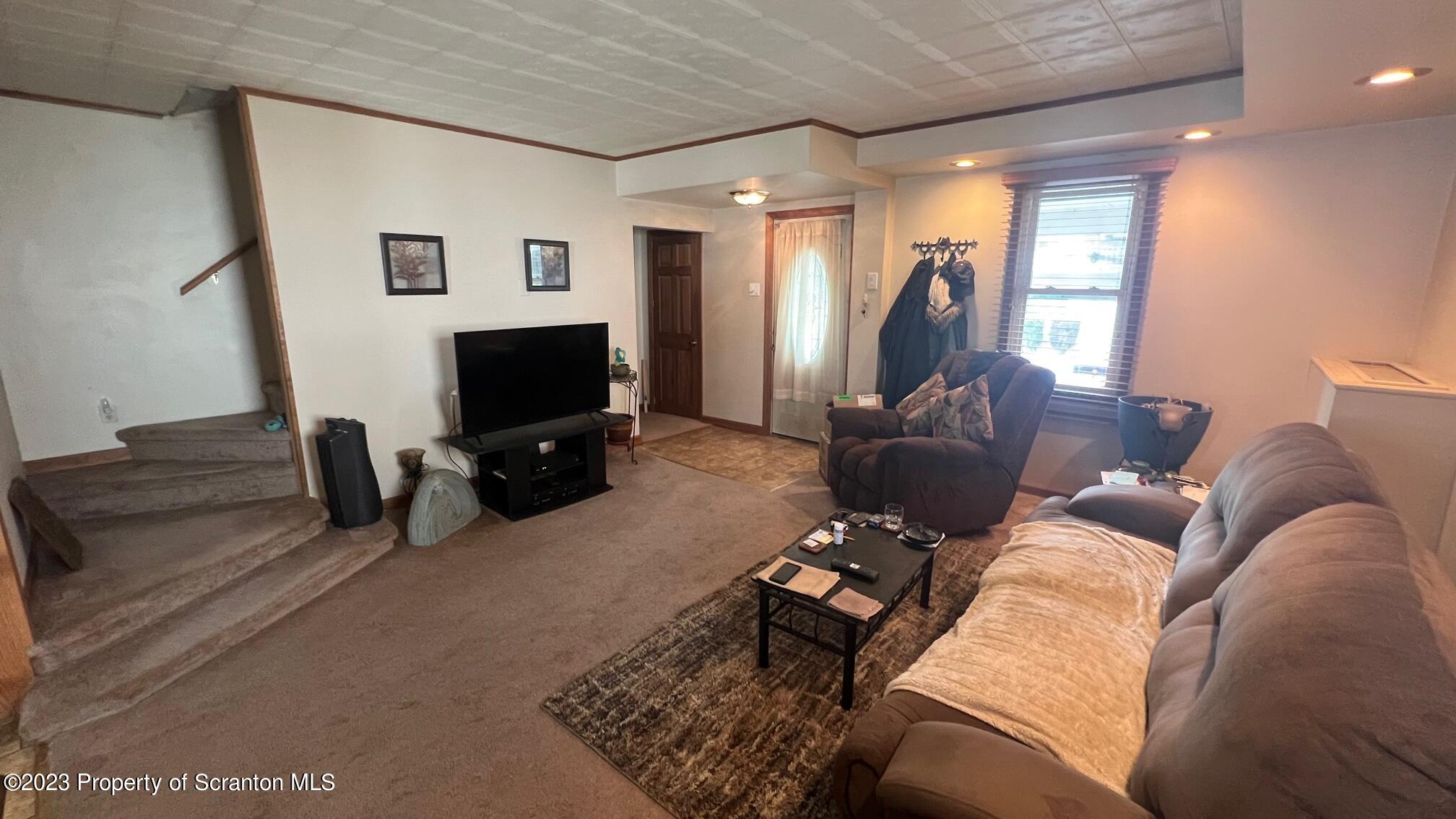 526 George Street Old Forge, PA 18518 - Photo 3 of 43 a living room with furniture and a flat screen tv