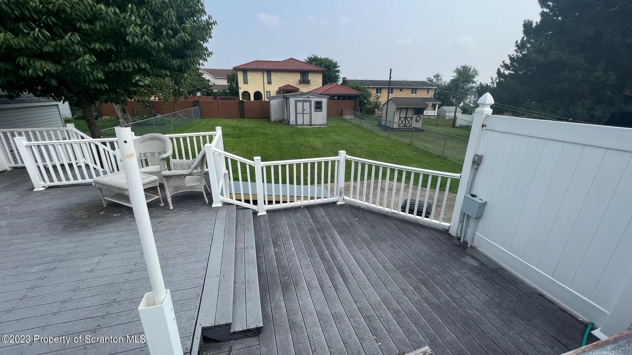 526 George Street Old Forge, PA 18518 - Photo 35 of 43 a view of a deck with two chairs and wooden floor