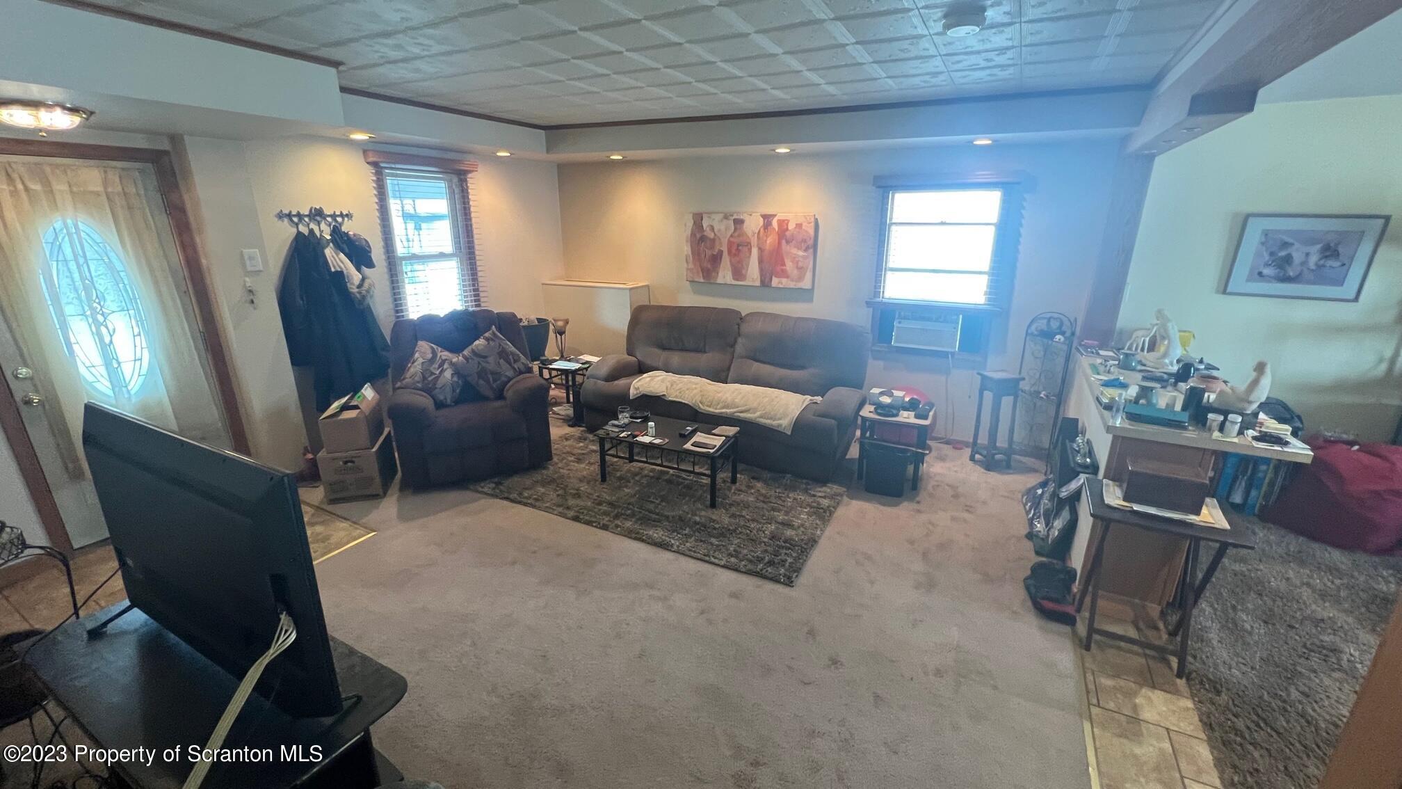 526 George Street Old Forge, PA 18518 - Photo 4 of 43 a living room with furniture and a window