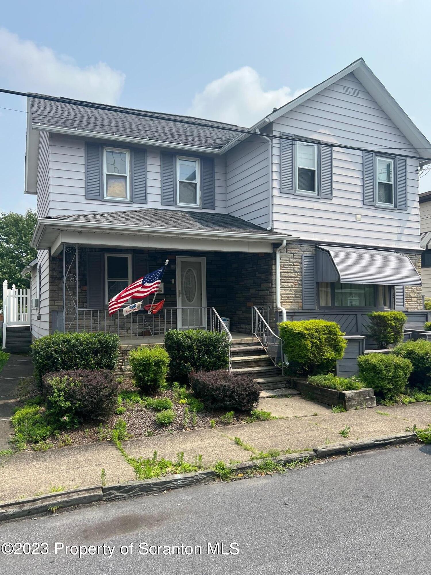526 George Street Old Forge, PA 18518 - Photo 43 of 43 a front view of a house with a yard and potted plants