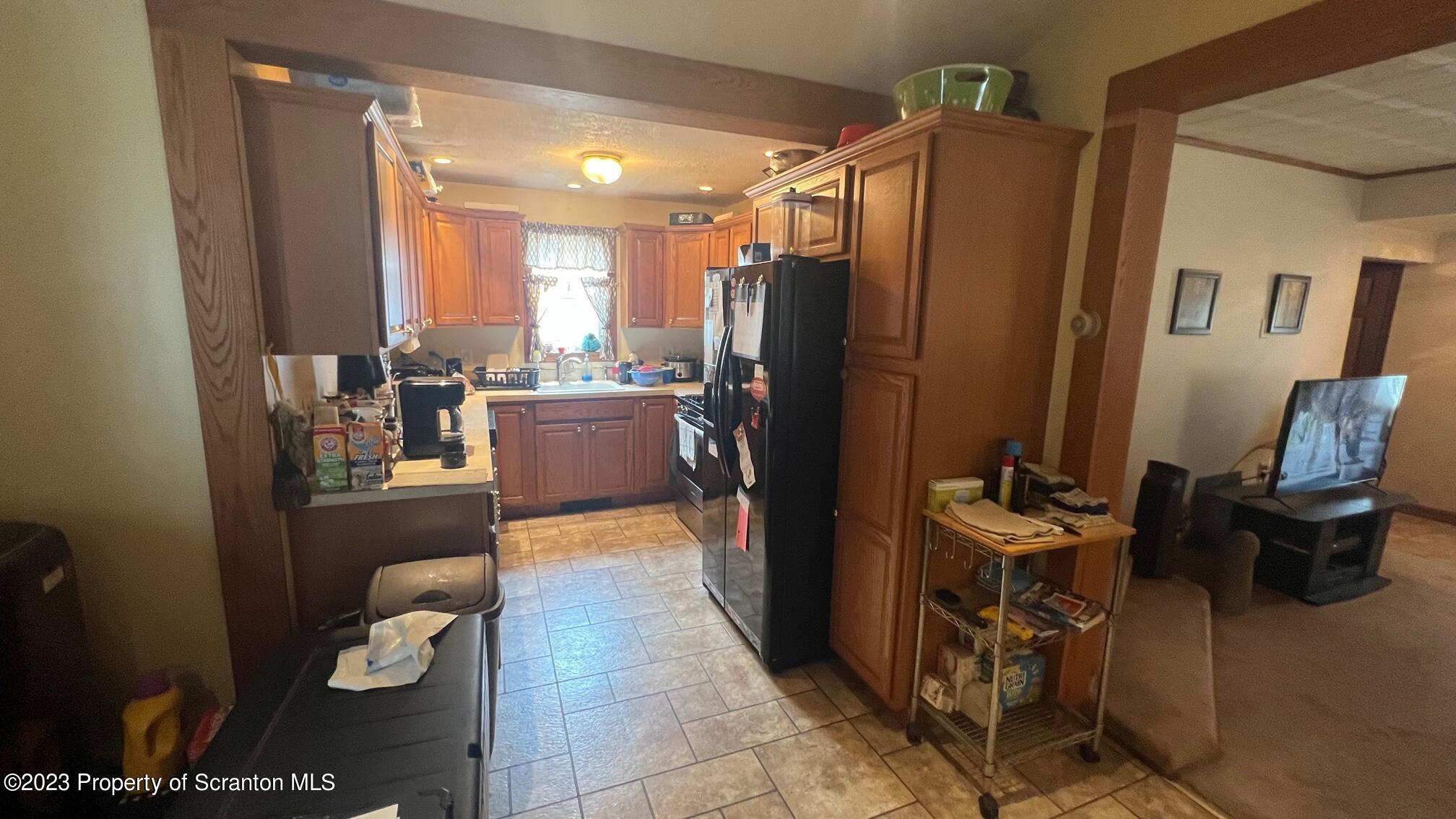 526 George Street Old Forge, PA 18518 - Photo 7 of 43 a kitchen with stainless steel appliances a refrigerator and a stove