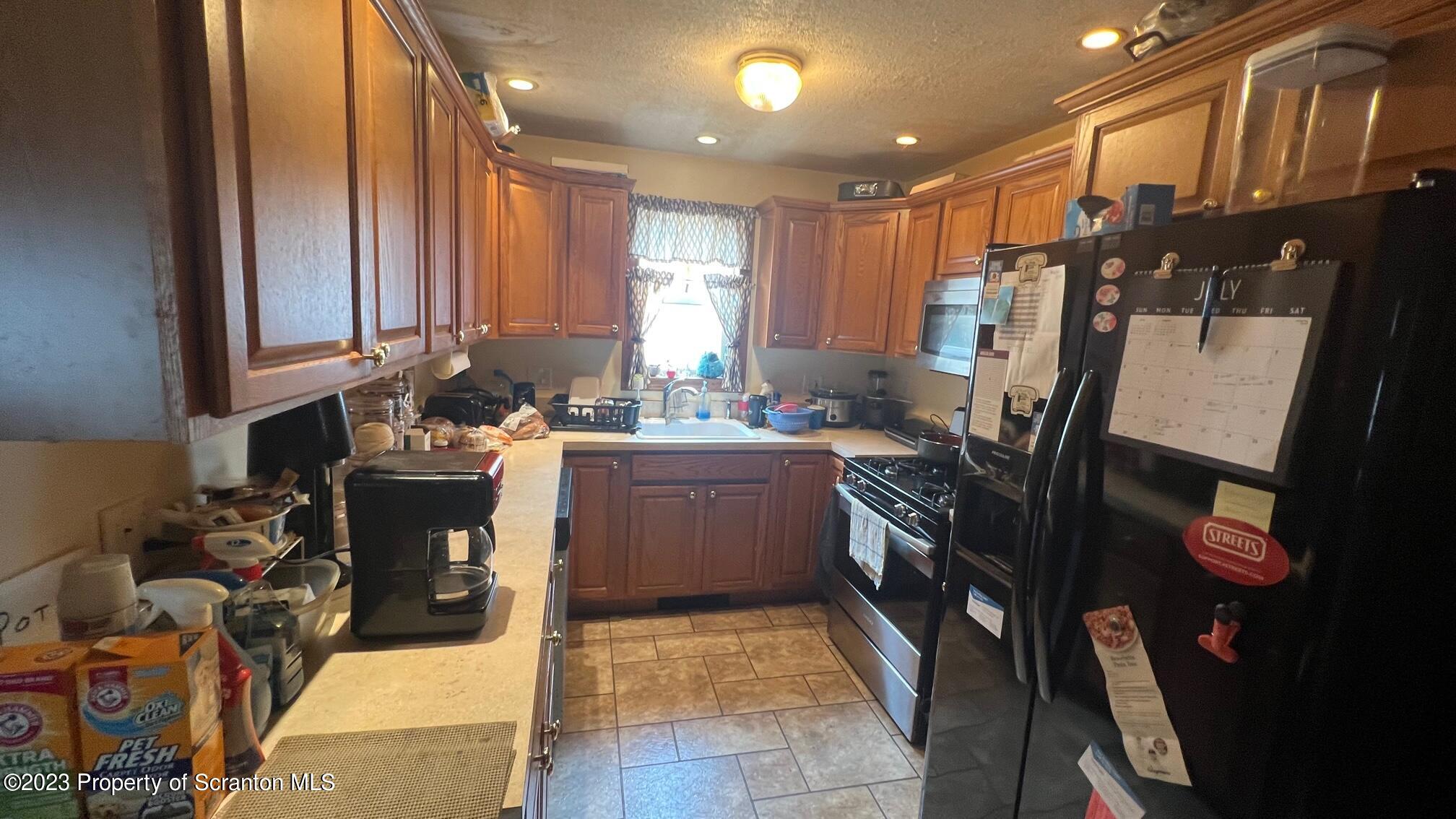 526 George Street Old Forge, PA 18518 - Photo 8 of 43 a kitchen with a sink appliances and cabinets