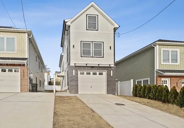 a front view of a house with a garage
