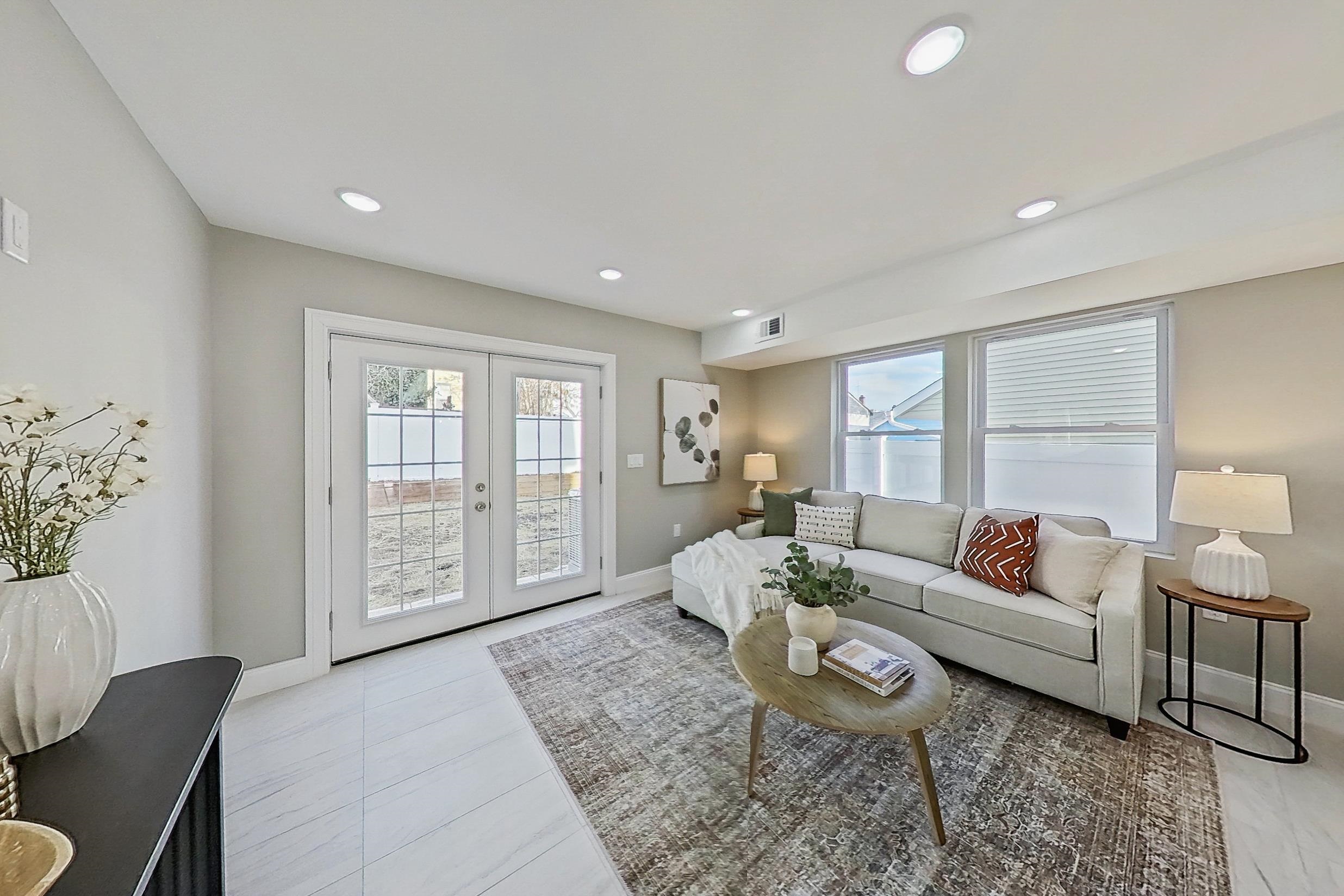 261 Winans Avenue Hillside, NJ 07205 - Photo 12 of 48 a living room with furniture and a large window