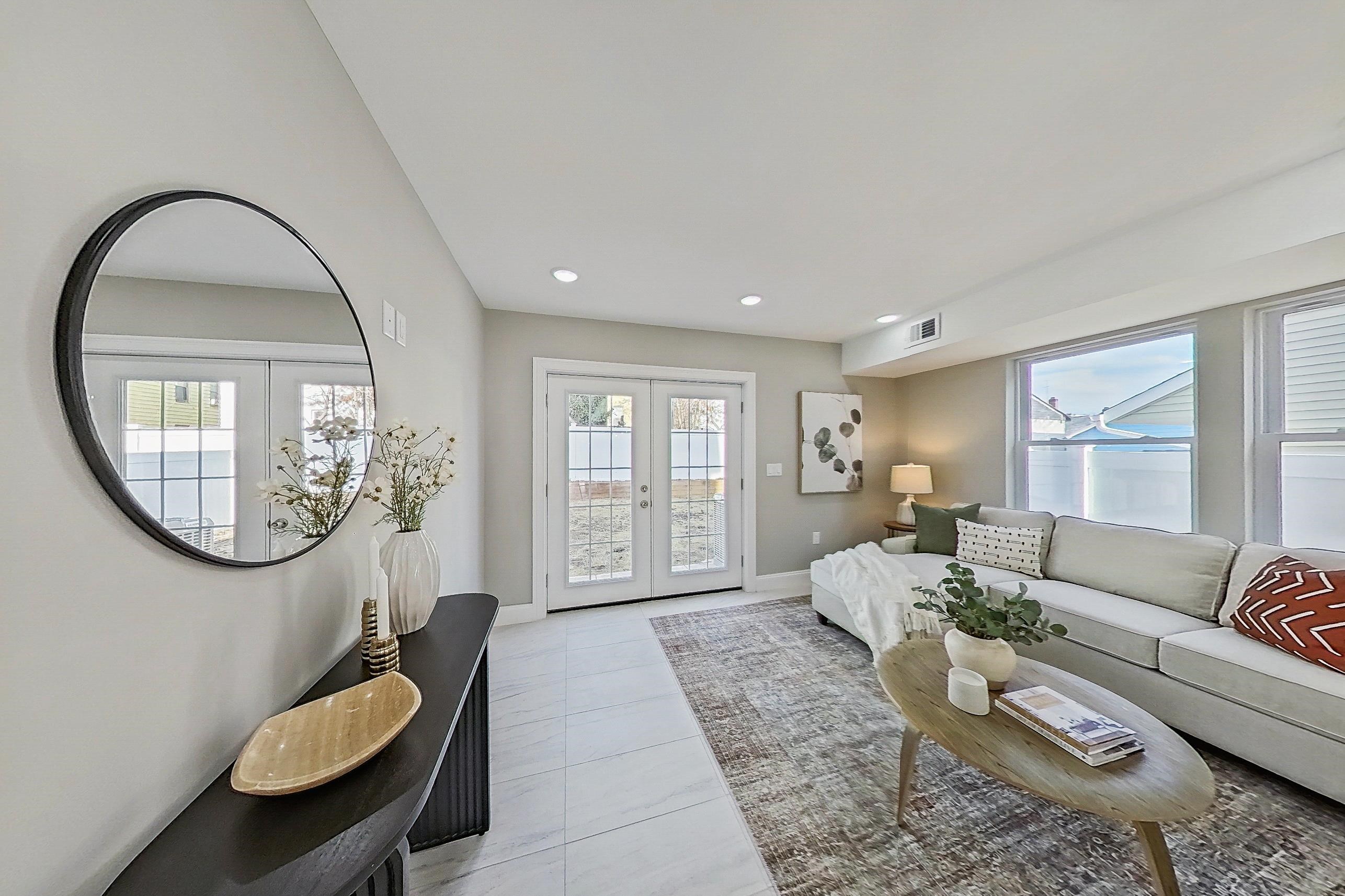 261 Winans Avenue Hillside, NJ 07205 - Photo 13 of 48 a living room with furniture and a large mirror