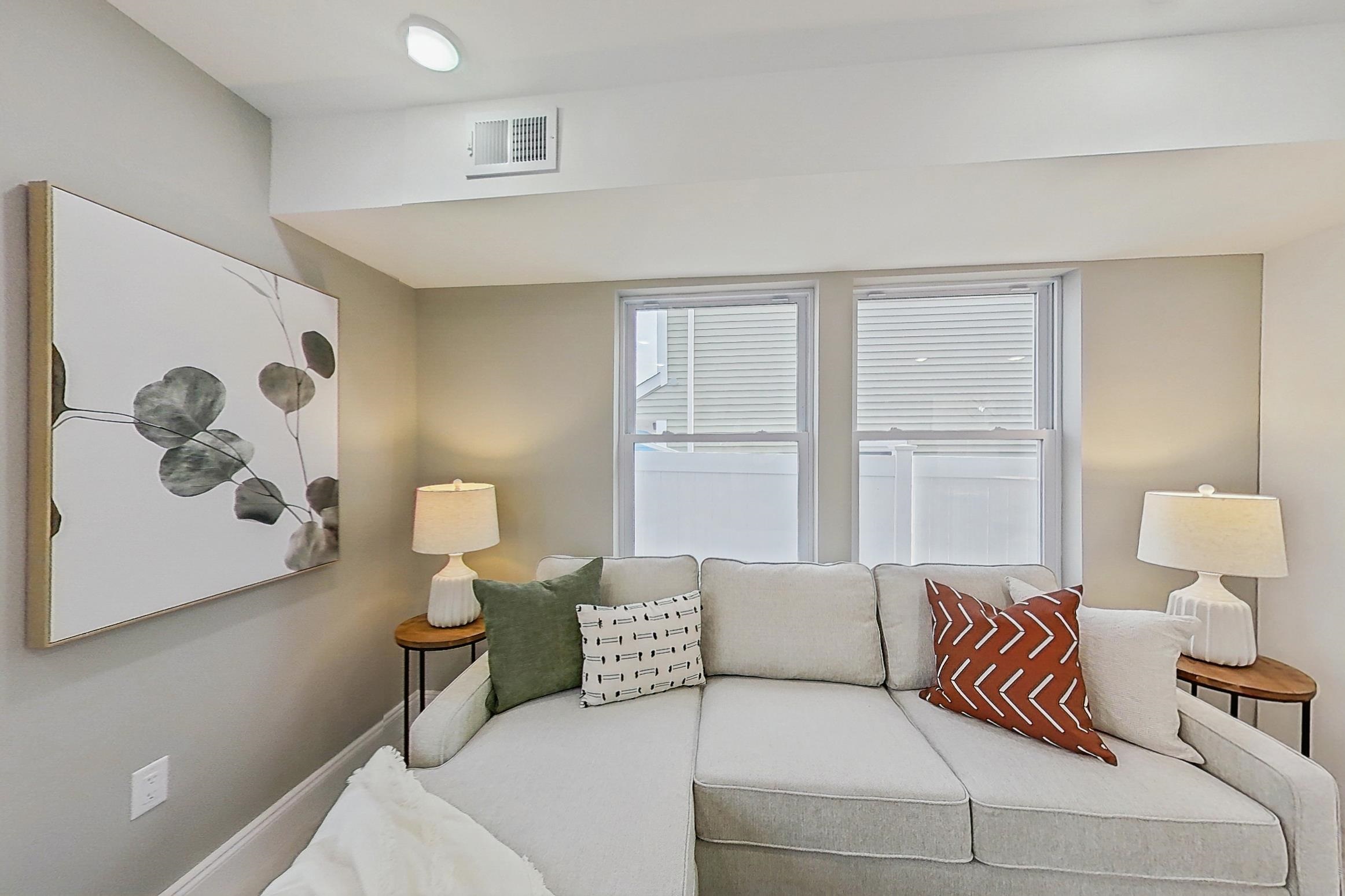 261 Winans Avenue Hillside, NJ 07205 - Photo 15 of 48 a living room with furniture and a large window