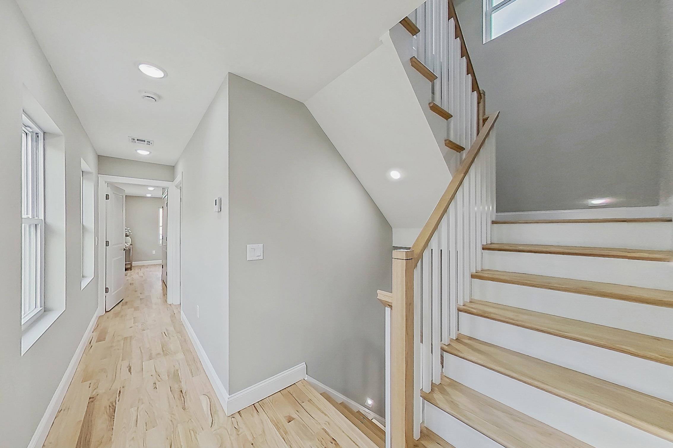 261 Winans Avenue Hillside, NJ 07205 - Photo 22 of 48 a view of a hallway with wooden floor and entryway