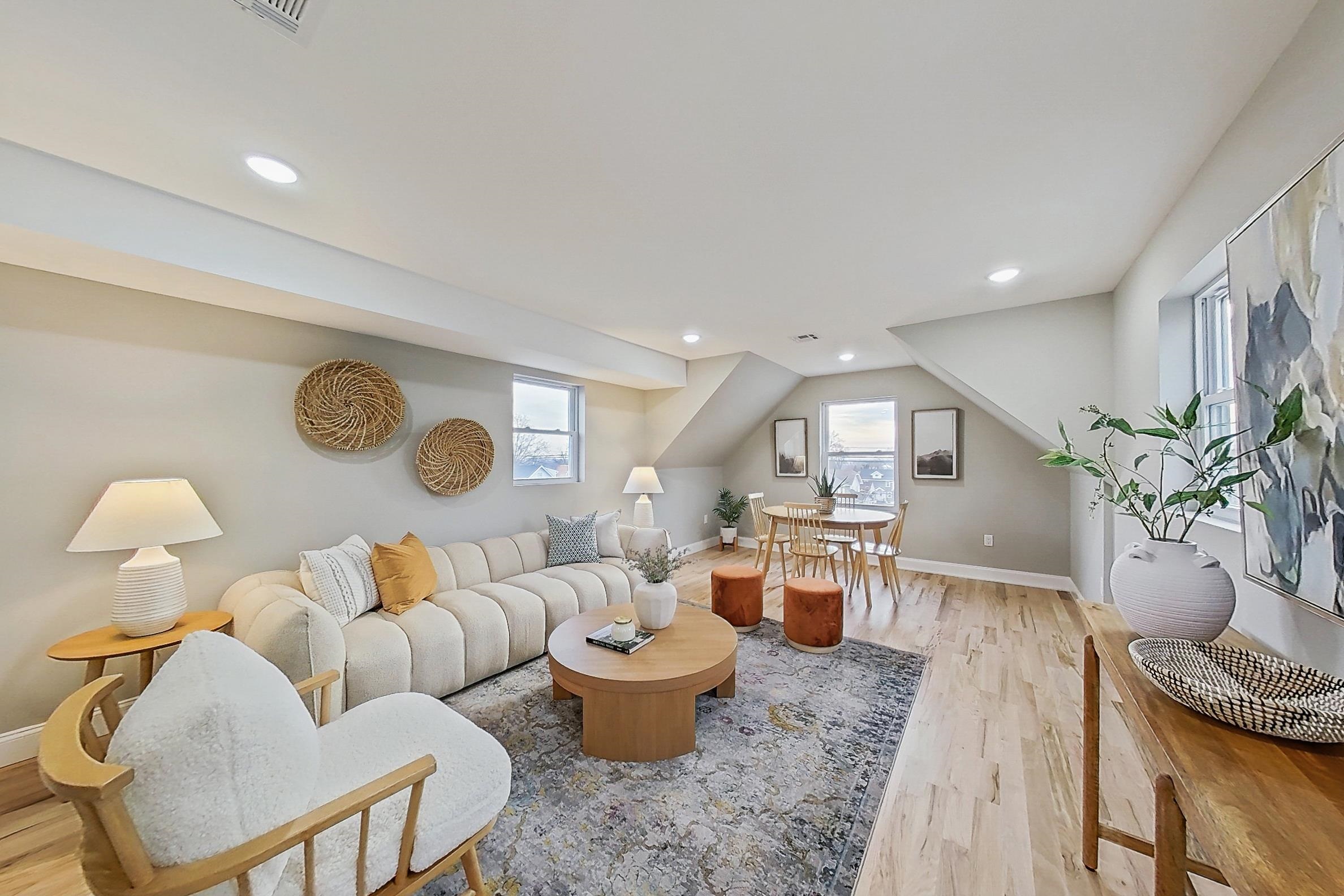 261 Winans Avenue Hillside, NJ 07205 - Photo 24 of 48 a living room with furniture and a clock