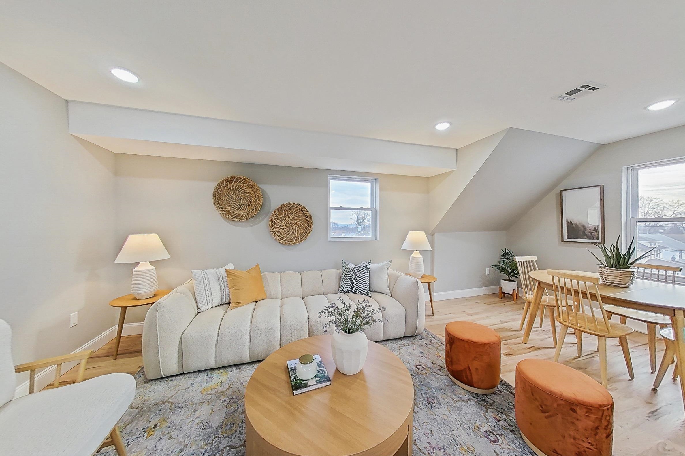 261 Winans Avenue Hillside, NJ 07205 - Photo 25 of 48 a living room with furniture and a wooden floor