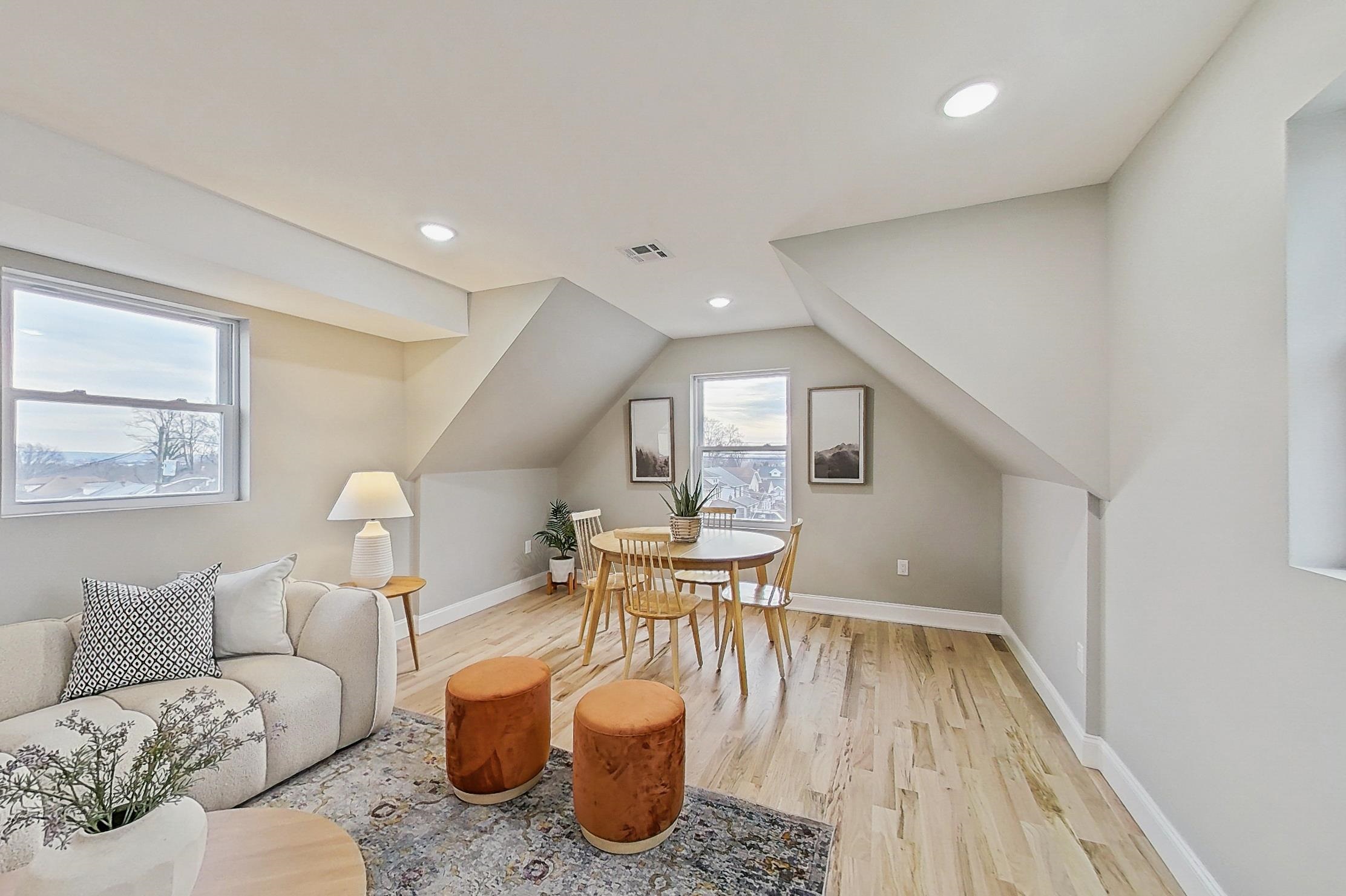 261 Winans Avenue Hillside, NJ 07205 - Photo 26 of 48 a living room with furniture and a wooden floor