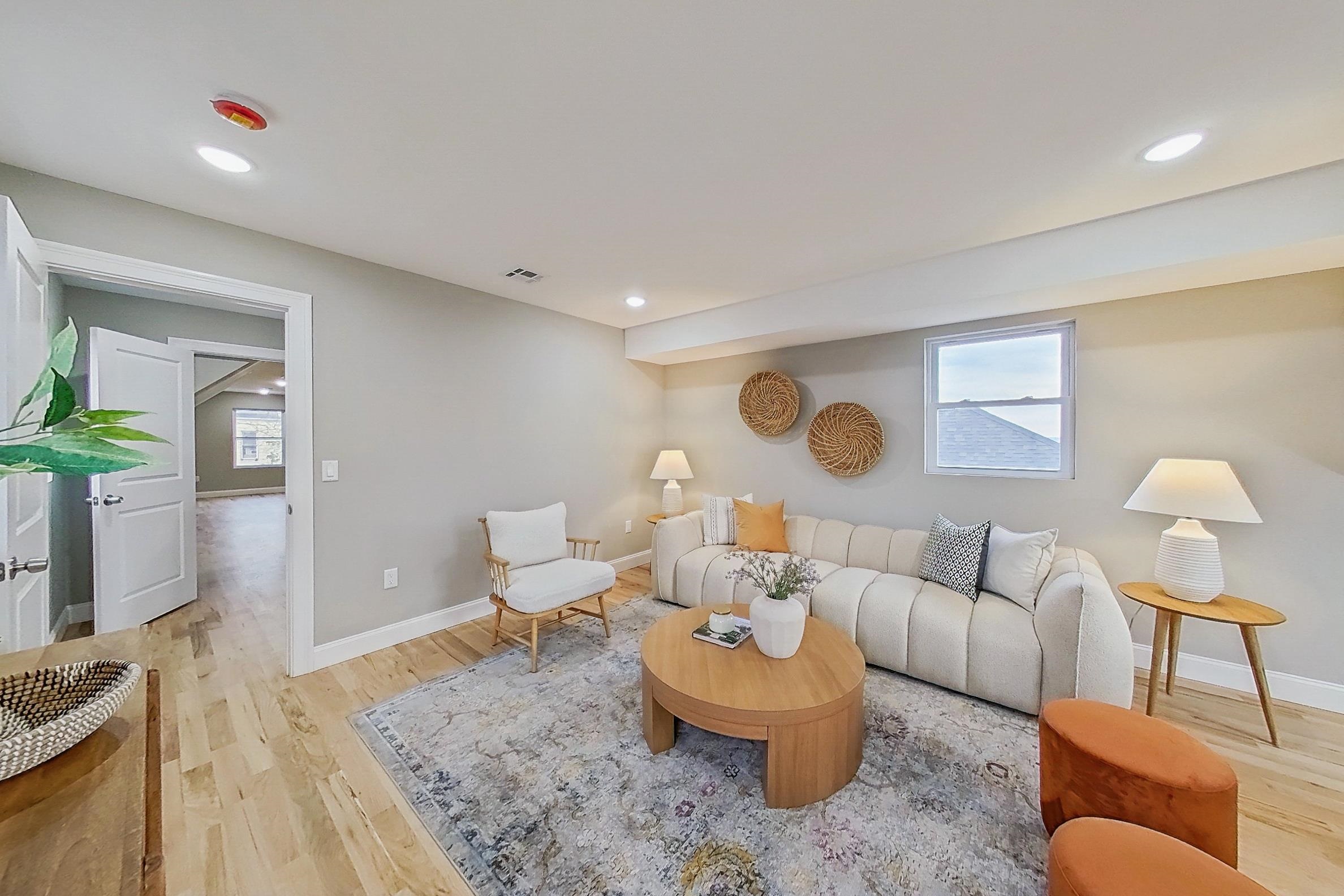 261 Winans Avenue Hillside, NJ 07205 - Photo 28 of 48 a living room with furniture and a rug