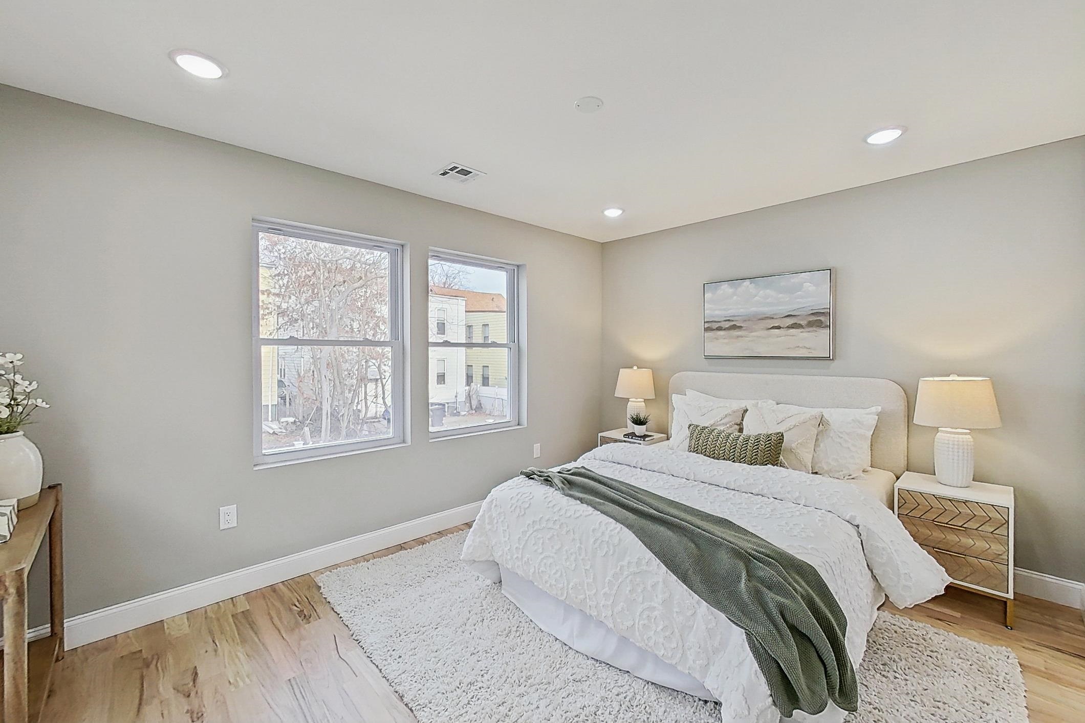 261 Winans Avenue Hillside, NJ 07205 - Photo 32 of 48 a bedroom with a bed and a window