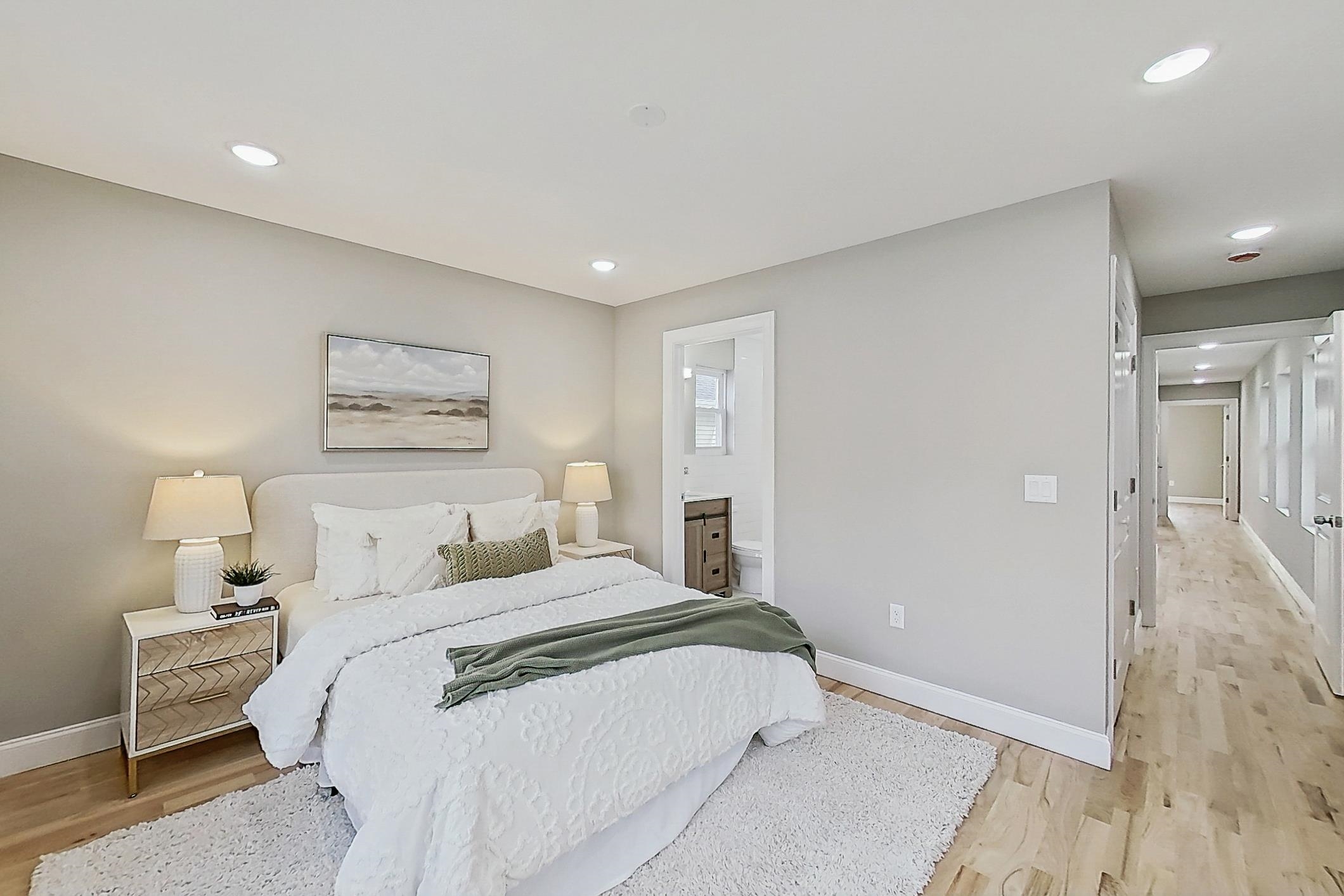 261 Winans Avenue Hillside, NJ 07205 - Photo 33 of 48 a bedroom with a bed and a painting on the wall