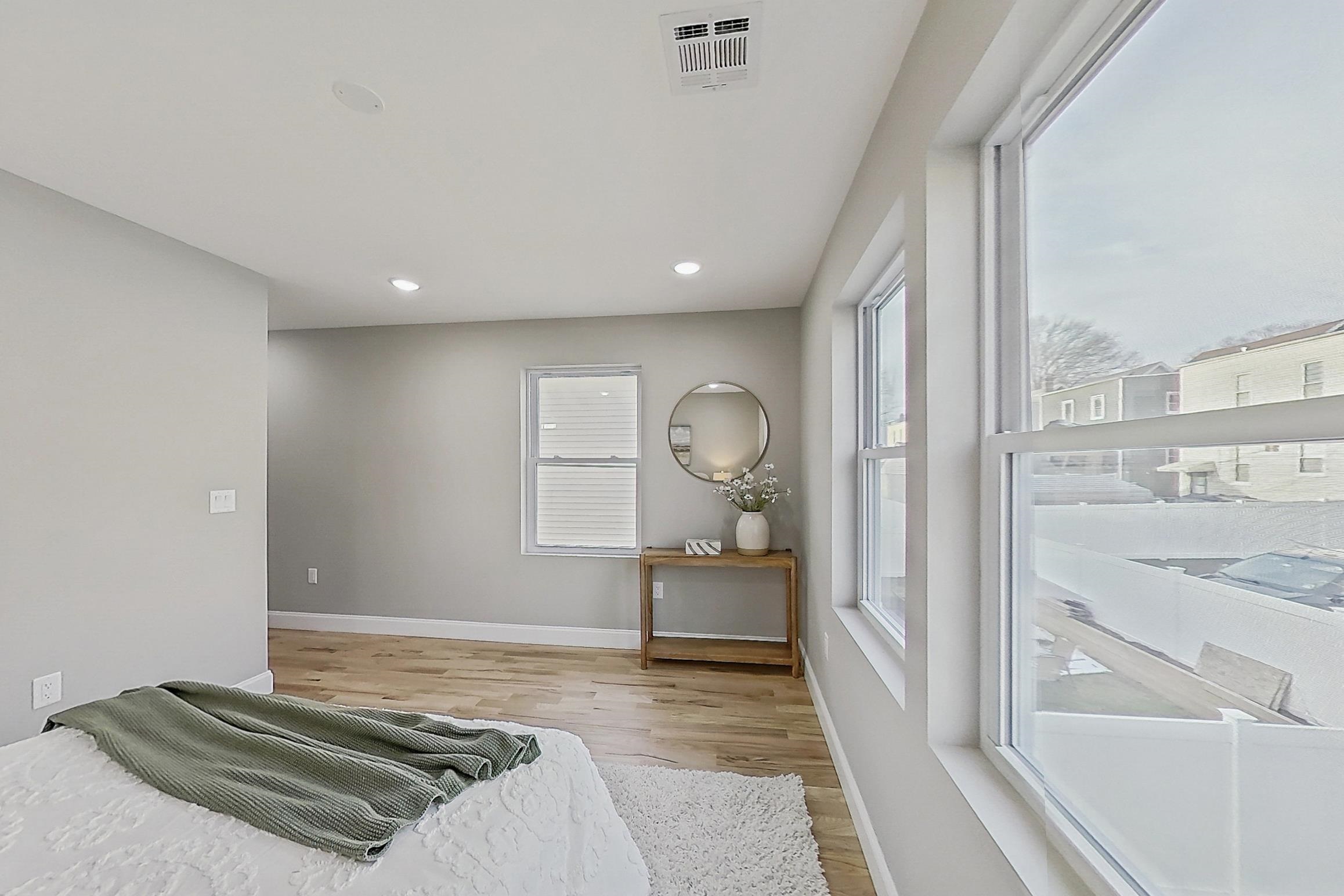 261 Winans Avenue Hillside, NJ 07205 - Photo 35 of 48 a bathroom with a sink and a mirror