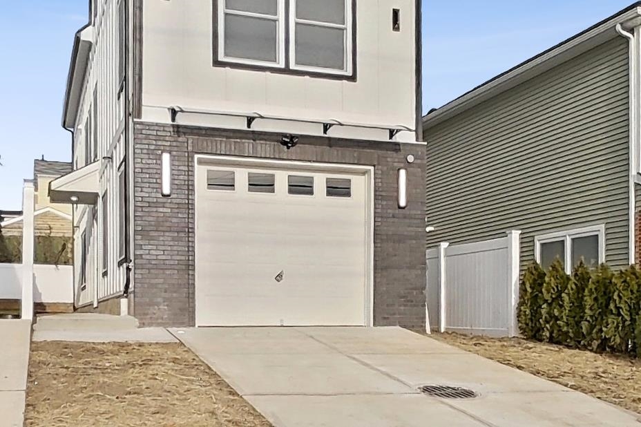 261 Winans Avenue Hillside, NJ 07205 - Photo 4 of 48 a front view of a house with a yard
