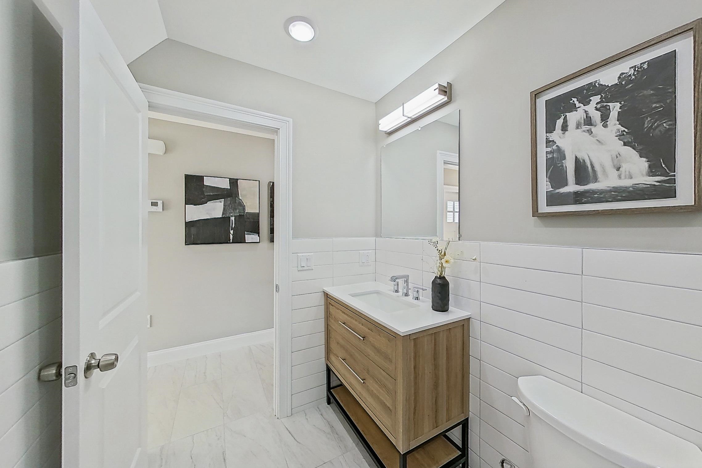 261 Winans Avenue Hillside, NJ 07205 - Photo 41 of 48 a bathroom with a sink mirror and toilet